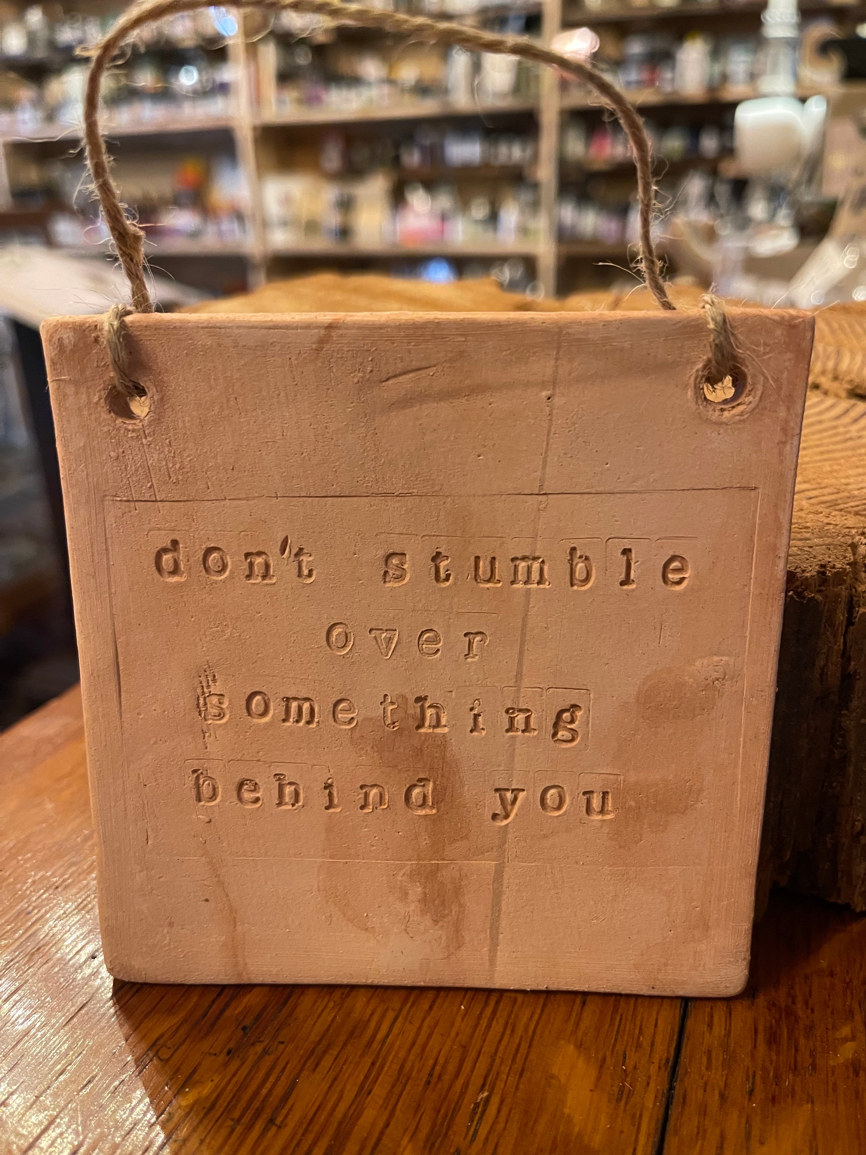 "Don't stumble over something behind you" Wall Hanging Tile