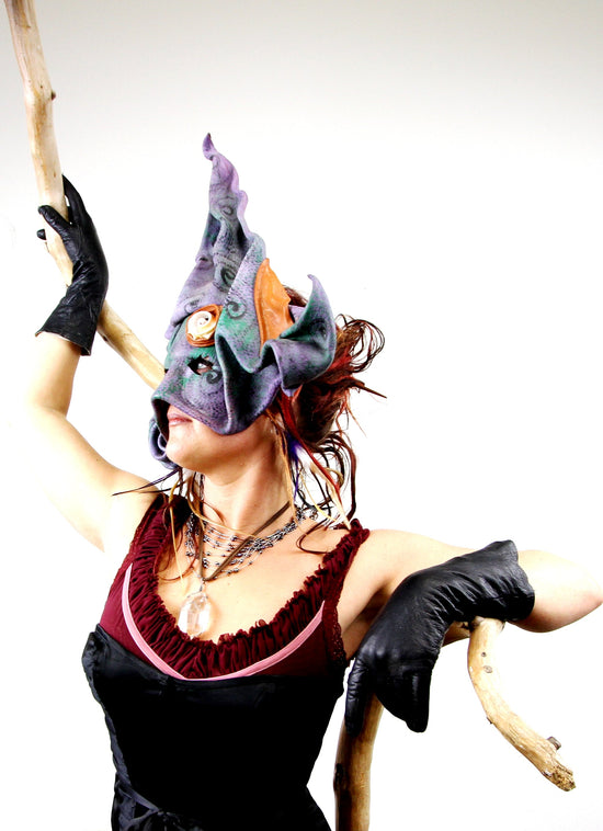 Marshe with her madrone stick, quartz necklace, and ritual mask