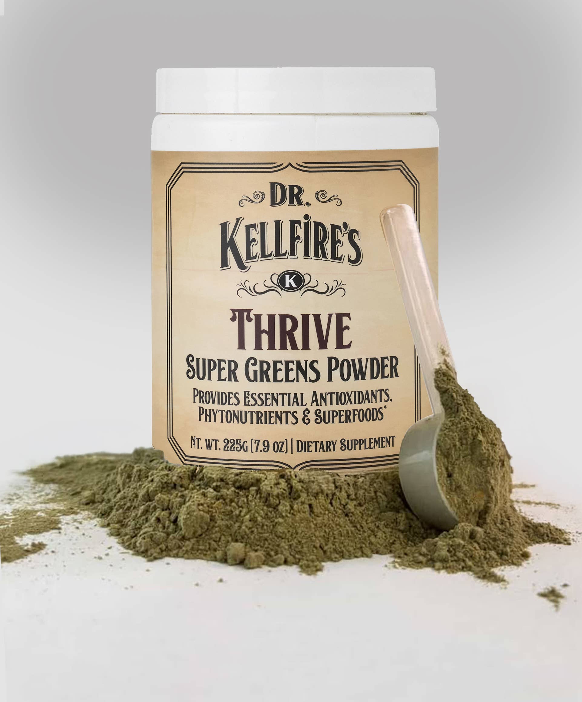 Dr. Kellfire's Thrive Super Greens Powder with a scoop on a light gray background. Sold at Townsend Draft Goods