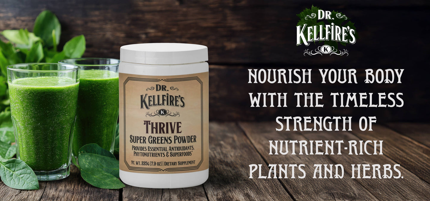Sold at Townsend Draft Goods. Dr. Kellfire's Thrive Super Greens Powder with green smoothies and spinach on a wooden surface.