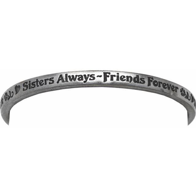 A silver-toned metal cuff bracelet engraved with the words 'Sisters Always - Friends Forever' and small heart motifs, shown against a plain white background.
